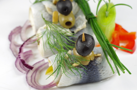appetizing rollmop with onion and dillの写真素材