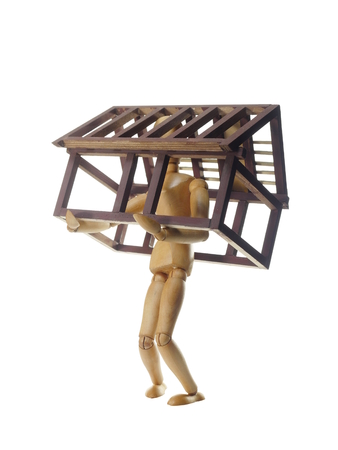 model of house and dummy on white backgroundの写真素材