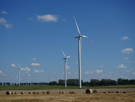 wind turbine on blue sky backgroundの写真素材