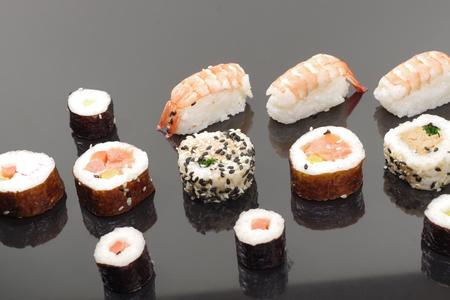  portion sushi on black plateの写真素材