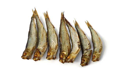 smoked whole sprats on white backgroundの写真素材