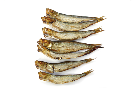 smoked whole sprats on white backgroundの写真素材