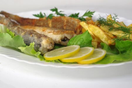 fried fish with saladの写真素材