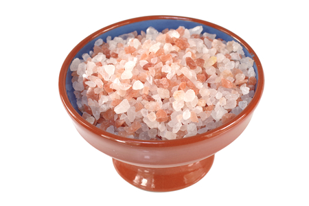 himalayan salt  in porcelain dish on white backgroundの写真素材