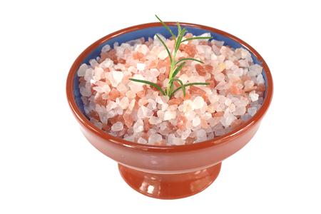 himalayan salt  in porcelain dish on white backgroundの写真素材