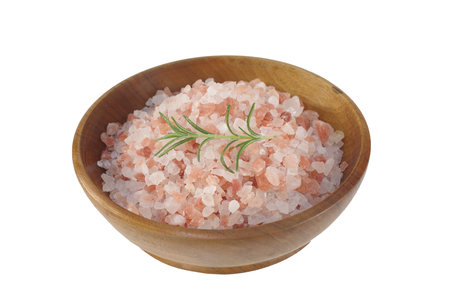 himalayan salt  in wooden dish on white backgroundの写真素材