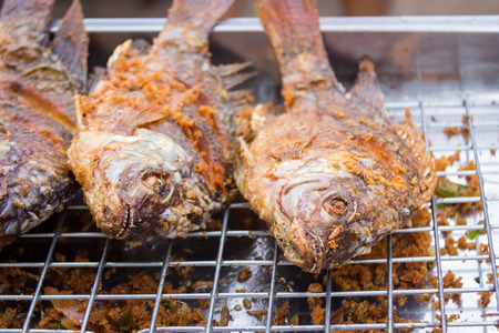 fried fish on sale at farmers marketの写真素材
