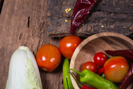 Vegetables and fruits on woodの写真素材