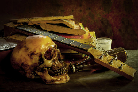 still life skull and guitar on woodの写真素材