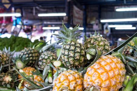 Pile of pineapples at the marketの写真素材