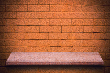 Empty top of natural stone shelves and stone wall background. For product displayの写真素材