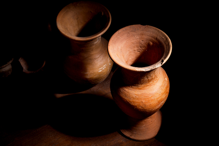 Still Life with a vase,earthenware on woodenの写真素材