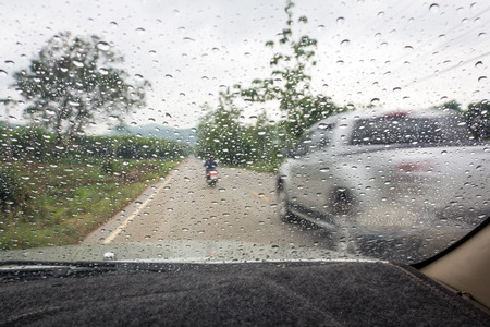 Raindrops on the windshield while driving on Thailand