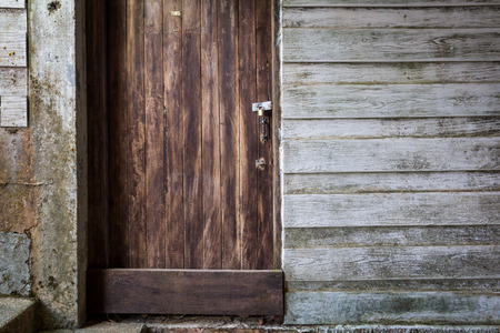 Old wooden door in local Thailand.の写真素材