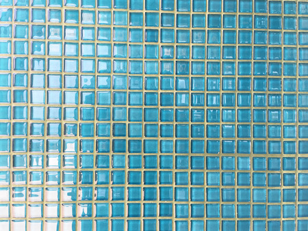 Small marble square tiles on background