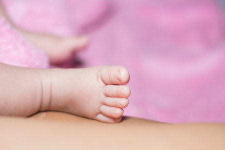Baby's feet on the mattressの写真素材