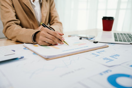 Businessman analyzing investment charts with laptop. Accounting,investment concept.の写真素材