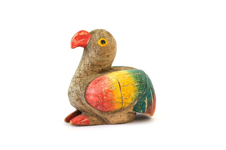 Wooden carved bird on white backgroundの写真素材