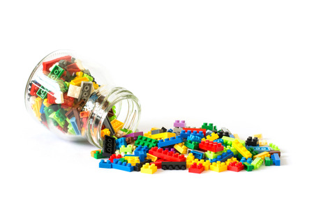 Toy colorful plastic blocks isolated on white backgroundの写真素材