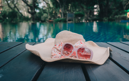 Hat and Sunglasses on the Swimming Pool.の写真素材