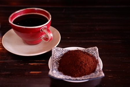 a cup of coffee on wooden backgroundの写真素材