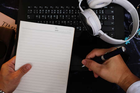 businessman using a mobile phone and working on the table background