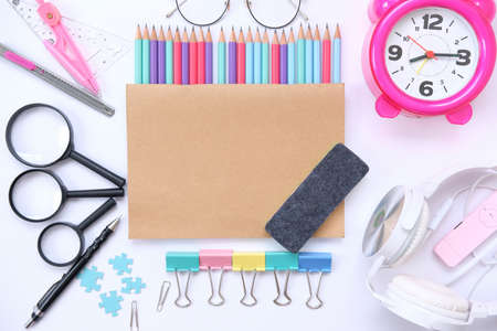 Back to school. Items for the school on a wooden table background and notebook space for text
