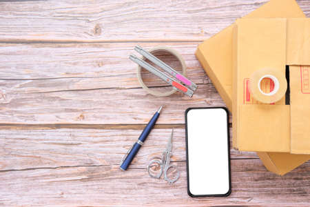 Back to school. Items for the school on a wooden table and white paper space for textの写真素材