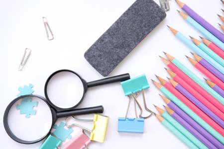 School item and office supplies on table background and space for text