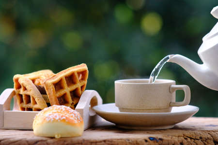 hot coffee and tea in the morning on wood table background and spaceの写真素材