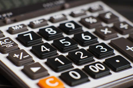 close up calculator on table and business conceptの写真素材