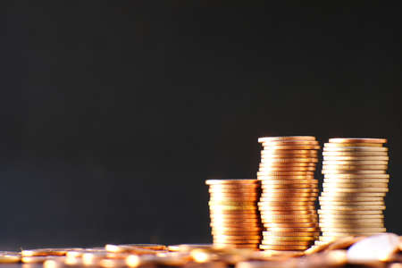 Golden coin on table background and business or finance saving moneyの写真素材