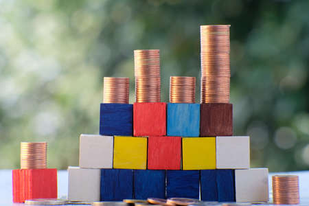 Golden coin on table background and business or finance saving moneyの写真素材