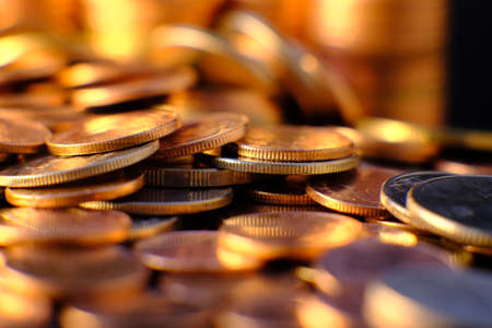stack of coin on table background and business or finance saving moneyの写真素材