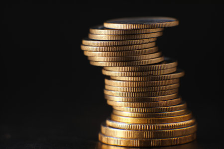 Golden coin on table background and business or finance saving money