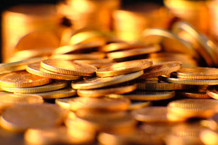 stack of coin on table background and business or finance saving moneyの写真素材