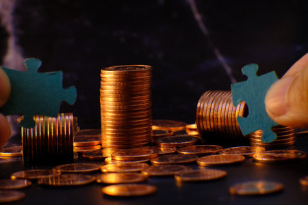 stacks of gold money coin on black background and concept saving money, business growth strategy of money concept, advertising coins of finance and bankingの写真素材