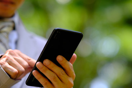 Businessman using a smartphone and technology network conceptsの写真素材