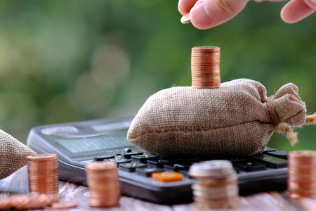 Savings, increasing columns of coins, piles of coins on the table, financial concept.