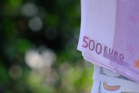 Fifty euro banknotes on blurred background with bokeh.の写真素材