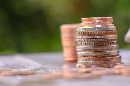 Coins stacked on each other in different positions. Money concept.の写真素材