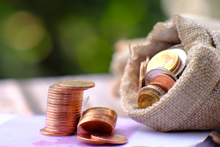 stacks of coin on table background and concept saving money, business growth strategy of money...