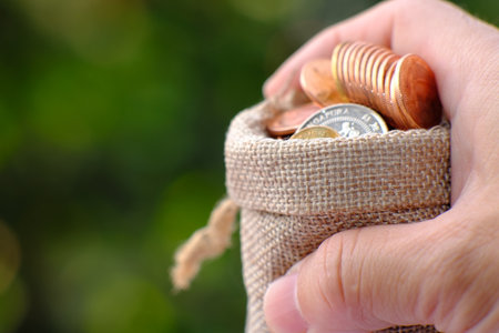 stacks of coin on table background and concept saving money, business growth strategy of money concept, advertising coins of finance and bankingの写真素材