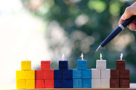 wood cube box and business icon on tableの写真素材