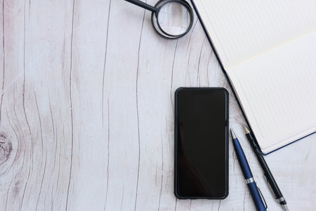 White paper and pencil on the table background and spaceの写真素材