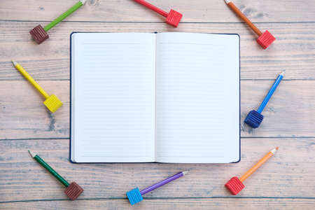 White paper and pencil on the table background and spaceの写真素材