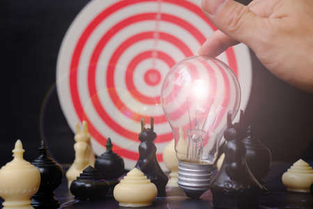 Hand holding chess board, Businessman play with chess game and business growth concept, Creative new...