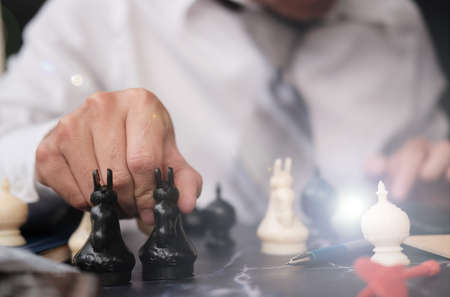 Hand holding chess board, Businessman play with chess game and business growth concept, Creative new...