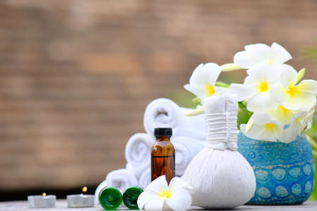 Spa treatments on old wooden table and candle light atmosphereの写真素材