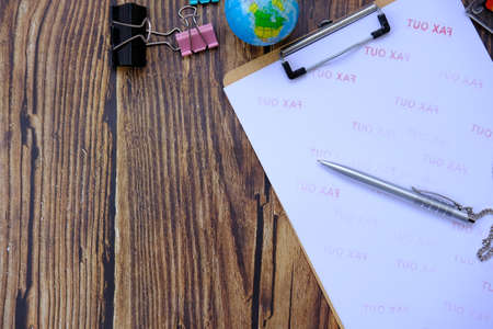 Top view on working space with office equipment and free space for textの写真素材